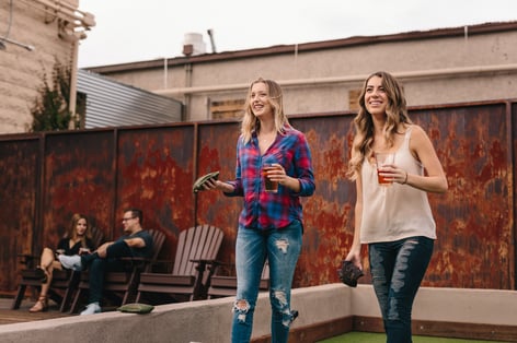 Playing corn hole at a brewery