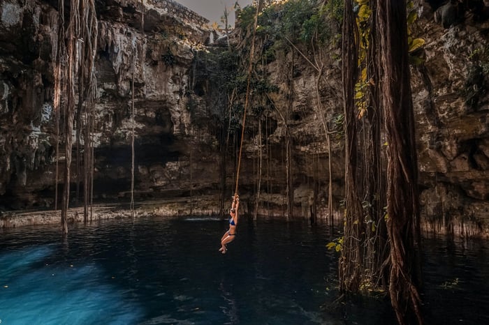 woman swimming in Tulum Mexico